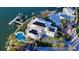 Stunning waterfront home with a private pool, dock, and solar panels on the roof at 1300 Tangier Way, Sarasota, FL 34239