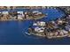 Aerial view of the home with beautiful landscaping and private dock at 1300 Tangier Way, Sarasota, FL 34239