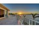 Breathtaking water views from this upper level balcony with white railing and tile floor at 1300 Tangier Way, Sarasota, FL 34239