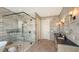 Stylish bathroom featuring a frameless glass shower and rustic wood-look tile at 1300 Tangier Way, Sarasota, FL 34239