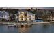 Waterfront home boasts private dock, pool, and spacious balcony overlooking serene waters, perfect for luxury living at 1300 Tangier Way, Sarasota, FL 34239