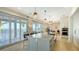 Gourmet kitchen featuring a large center island, stainless steel appliances, and water view from the breakfast bar at 1300 Tangier Way, Sarasota, FL 34239
