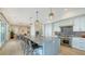 Open-concept kitchen featuring a large island, stainless steel appliances, and sleek countertops at 1300 Tangier Way, Sarasota, FL 34239