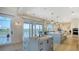 Modern kitchen with dual islands, premium appliances, and sliding glass doors to capture the waterfront scenery at 1300 Tangier Way, Sarasota, FL 34239