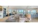 Comfortable living room with stylish decor, ample seating, and large windows offering scenic outdoor views at 1300 Tangier Way, Sarasota, FL 34239