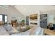 Bright and airy living room featuring a modern fireplace, comfortable seating, and stylish built-in bookshelves at 1300 Tangier Way, Sarasota, FL 34239