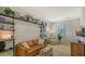 Cozy living room with stylish shelving, comfortable seating, and plenty of natural light at 1300 Tangier Way, Sarasota, FL 34239