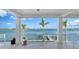 Covered patio with white pillars and a scenic waterfront view at 1300 Tangier Way, Sarasota, FL 34239