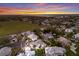 Scenic aerial view featuring waterfront community, lush green landscape and stunning sunset in the background at 1528 43Rd Avenue W Dr, Palmetto, FL 34221