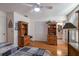 Bedroom featuring hardwood floors, built-in storage, and access to the ensuite bath at 1528 43Rd Avenue W Dr, Palmetto, FL 34221