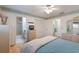 Comfortable bedroom showcasing a queen-sized bed, ensuite bathroom, and plenty of closet space at 1528 43Rd Avenue W Dr, Palmetto, FL 34221