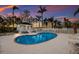 Sparkling community pool surrounded by lounge chairs and lush landscaping provides a relaxing retreat at 1528 43Rd Avenue W Dr, Palmetto, FL 34221