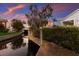 Private wooden dock along a canal, surrounded by lush landscaping at 1528 43Rd Avenue W Dr, Palmetto, FL 34221