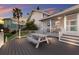 Beautiful outdoor deck with picnic table and a screened-in porch on a charming home at 1528 43Rd Avenue W Dr, Palmetto, FL 34221