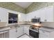 The kitchen features white cabinets, stainless steel appliances, and light countertops at 1528 43Rd Avenue W Dr, Palmetto, FL 34221