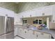 Eat-in kitchen with white cabinets, granite counters and stainless steel appliances at 1528 43Rd Avenue W Dr, Palmetto, FL 34221