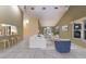 Open-concept living room flows into a dining area and kitchen with a breakfast bar and stainless steel appliances at 1528 43Rd Avenue W Dr, Palmetto, FL 34221