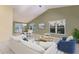 Bright living room featuring vaulted ceilings, dining area, and large windows providing ample natural light at 1528 43Rd Avenue W Dr, Palmetto, FL 34221