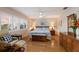 Main bedroom with wood floors, ceiling fan, bright windows and ample natural light at 1528 43Rd Avenue W Dr, Palmetto, FL 34221