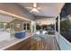 Covered patio with sliding glass doors offering outdoor dining space and serene water views at sunset at 1528 43Rd Avenue W Dr, Palmetto, FL 34221