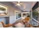 Lovely screened porch with ceiling fans, waterfront view, and comfortable seating at 1528 43Rd Avenue W Dr, Palmetto, FL 34221