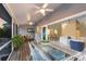Spacious screened-in porch with comfortable seating and dining area; perfect for entertaining at 1528 43Rd Avenue W Dr, Palmetto, FL 34221