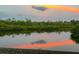 Scenic water view reflecting the sky and clouds, enhancing the property's natural beauty at 1528 43Rd Avenue W Dr, Palmetto, FL 34221