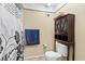 Bathroom featuring toilet and cabinet for extra storage at 16211 Rambling Vine W Dr, Tampa, FL 33624