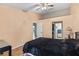 Bedroom with neutral walls, tile flooring, and easy access to the ensuite bathroom at 16211 Rambling Vine W Dr, Tampa, FL 33624