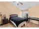 Cozy bedroom with ceiling fan, access to outdoor patio and neutral paint at 16211 Rambling Vine W Dr, Tampa, FL 33624