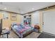 Bedroom featuring light-colored wooden floors, a ceiling fan, closet, and a decorative blanket at 16211 Rambling Vine W Dr, Tampa, FL 33624