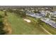 Scenic golf course view with lush greenery and nearby residential area at 16211 Rambling Vine W Dr, Tampa, FL 33624