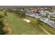 Scenic golf course view with lush greenery and nearby residential area at 16211 Rambling Vine W Dr, Tampa, FL 33624