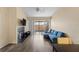 Inviting living room with a fireplace, hardwood floors, and a sliding door leading to the outside at 16211 Rambling Vine W Dr, Tampa, FL 33624