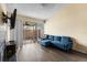 Comfortable living room with a large sectional sofa and a sliding glass door to the screened porch at 16211 Rambling Vine W Dr, Tampa, FL 33624