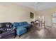 Spacious living room with hardwood floors, comfortable seating, and ample natural light at 16211 Rambling Vine W Dr, Tampa, FL 33624