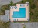 Aerial view of a community pool featuring ample lounge seating and adjacent parking at 16211 Rambling Vine W Dr, Tampa, FL 33624