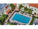 Overhead shot of community pool, palm trees, lounge chairs, and manicured landscaping at 1685 Laurel St # 4, Sarasota, FL 34236