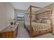 Bedroom with traditional wood furniture, neutral walls, and window views at 17448 Hickok Belt Loop, Bradenton, FL 34211