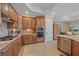 Well-equipped kitchen featuring granite counters, stainless steel appliances, and ample cabinet space at 17448 Hickok Belt Loop, Bradenton, FL 34211