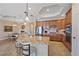 Kitchen island with breakfast bar, granite countertops, and stainless steel appliances at 17448 Hickok Belt Loop, Bradenton, FL 34211