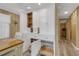 Dining area features custom cabinets with drawers and shelves for ample storage at 1874 Woodstock Ln, Sarasota, FL 34234