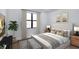 Cozy bedroom featuring a plush bed, large windows, and stylish decor for a relaxing retreat at 18803 Dayspring Pl, Venice, FL 34293