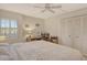 Neutral bedroom features a bed, desk, and closet at 19 Whispering Sands Dr # 303, Sarasota, FL 34242