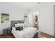 Bedroom with neutral tones, closet access, and natural light creates a restful retreat at 2220 Pine Ter, Sarasota, FL 34231