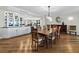 Dining room featuring hardwood floors, a dining table, and built in china cabinets at 2410 Harbourside Dr # 121, Longboat Key, FL 34228