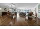 Expansive dining room with hardwood flooring, water views, and elegant furnishings at 2410 Harbourside Dr # 121, Longboat Key, FL 34228
