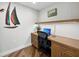 Home office with custom wood desk, ample storage, and a modern design at 2410 Harbourside Dr # 121, Longboat Key, FL 34228