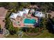 Resort-style pool area with lounge chairs and cabanas in a waterfront community at 2410 Harbourside Dr # 121, Longboat Key, FL 34228