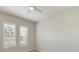 Bright bedroom with shuttered windows and neutral decor, offering a serene space at 26833 Weiskopf Dr, Englewood, FL 34223